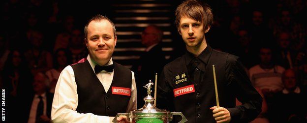 Judd Trump and John Higgins in 2011 with the trophy