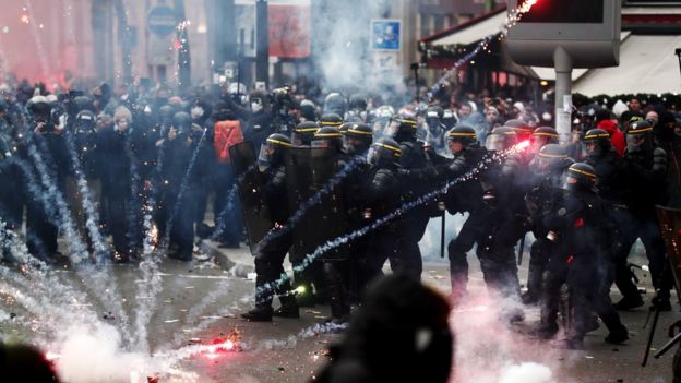 police and protesters clash in Paris