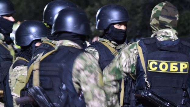 Members of the Kyrgyz special forces blockade a street in the village of Koi-Tash. 8 Aug 2019