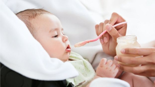 Baby being fed