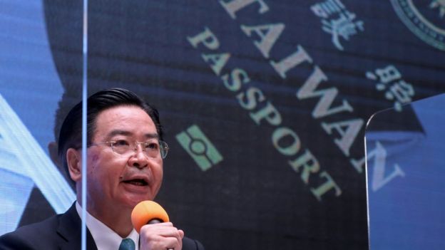 Taiwan Foreign Minister Joseph Wu revealing a new passport design