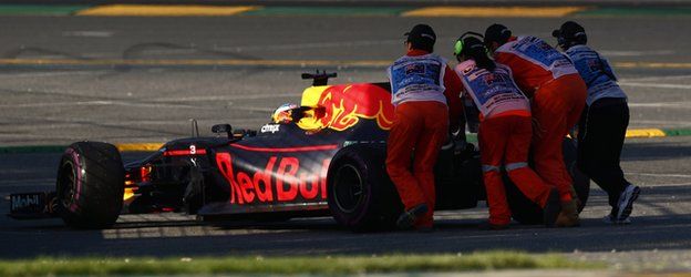 Ricciardo's car is pushed off the track