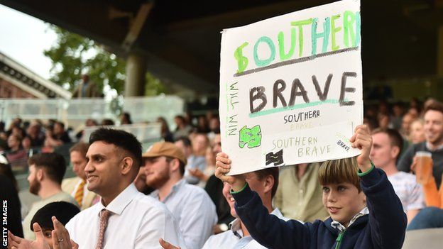 A Southern Brave fan holds up a sign at Lord's for the Hundred final