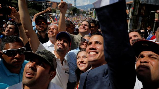 Venezuelan opposition leader and self-proclaimed interim president Juan Guaido and opposition leader Henrique Capriles attend a rally against Venezuelan President Nicolas Maduro"s government in Caracas, Venezuela February 2, 2019