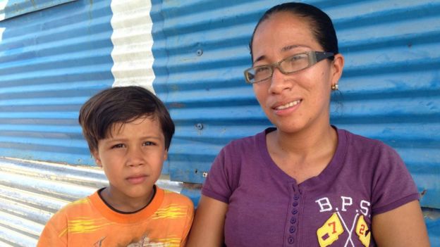 Darnellys Rodríguez with one of her children