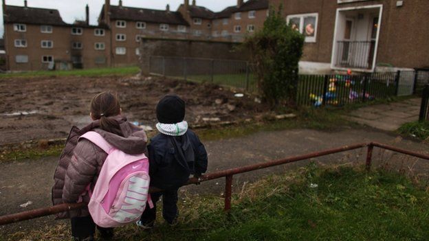 Children make their way home on a housing estate in Scotland