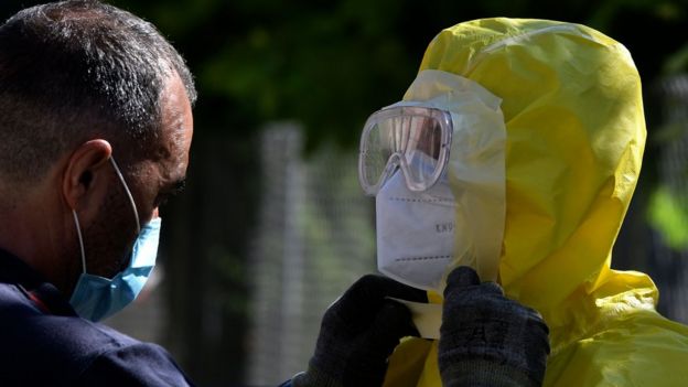 Firefighters prepare before disinfecting a nursing home for elderly people where more than 60 people tested positive for Covid-19 in Burbaguena, near Teruel on 4 August 2020
