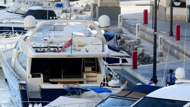 Policemen leave the luxury yacht Gio, owned by Yorgen Fenech, a businessman, after it was escorted back into the Portomaso Marina in St Julian"s, Malta
