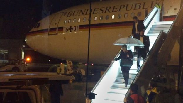German Chancellor Angela Merkel steps down from Airbus "Konrad Adenauer" on late November 29, 2018