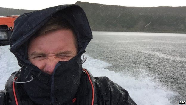 BBC News NI environment correspondent Conor Macauley on a boat in search of dolphins