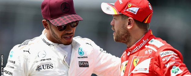 Lewis Hamilton and Sebastian Vettel have a chat after qualifying