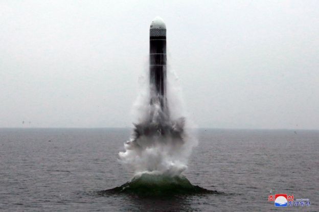 What appears to be a submarine-launched ballistic missile (SLBM) flies in an undisclosed location in this undated picture released by North Korea's official news agency