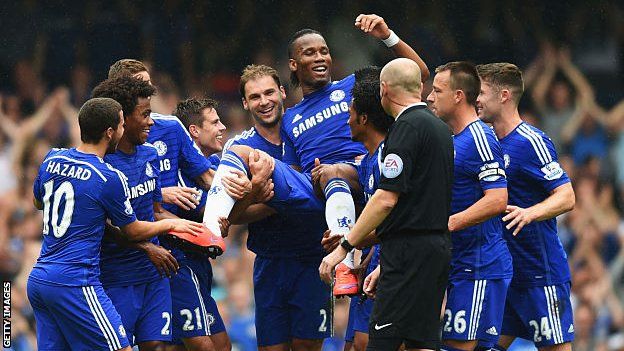 Didier Drogba being chaired off the pitch in his last game for Chelsea in 2015