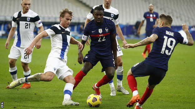 Franc's Lucas Digne and Marcus Thuram, as well as Finland's Rasmus Schuller, in action during the friendly between France and Finland in Paris