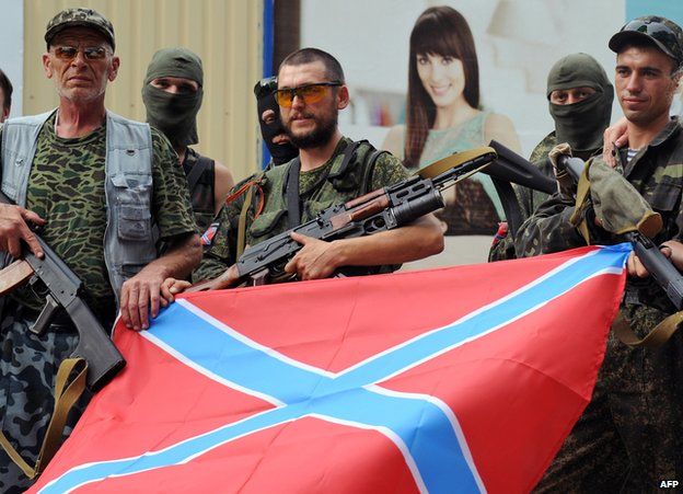 Separatist troops in Donetsk with Novorossiya flag