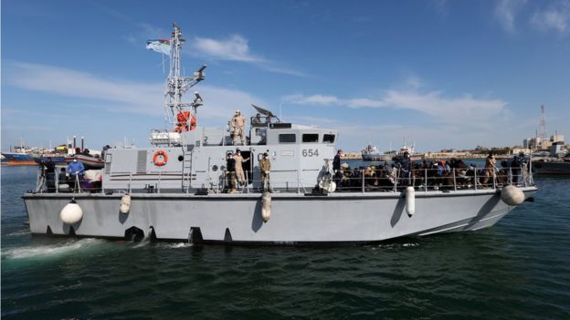 Libyan navy boat with migrants on board arrives at navy base in Tripoli, Libya 23 November 2017