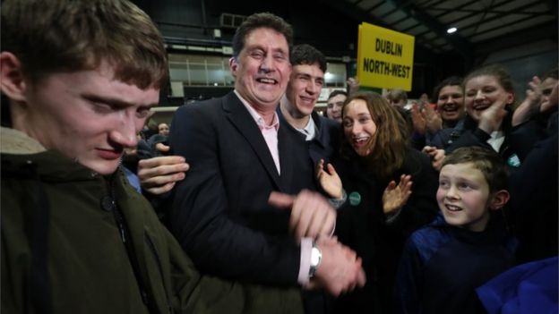 Green Party leader Eamon Ryan is surrounded by his family as he is elected in the Dublin Bay South constituency during the Irish General Election count at the RDS in Dublin.