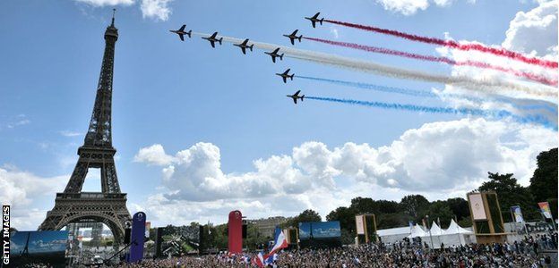 Paris marks the handover of the Olympic flag with crowds and aerobatics