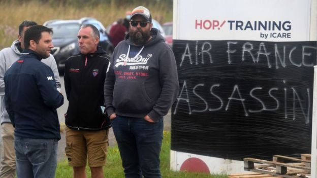 Protestors at the entrance of an airport in Morlaix, western France