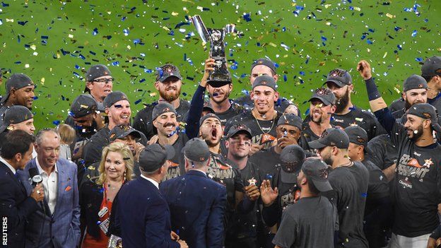 Houston Astros celebrate with the American League Championship Series trophy