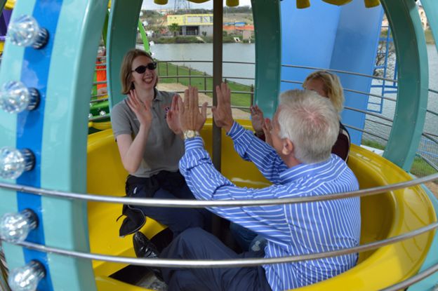 Morgan and her parents enjoying the Ferris wheel at Morgan's Wonderland