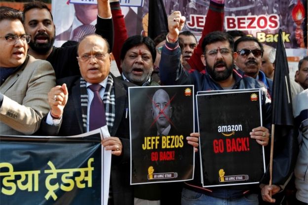 Members of the Confederation of All India Traders (CAIT) hold placards and shout slogans during a protest against the visit of Jeff Bezos, founder of Amazon, to India, in New Delhi, India, January 15, 2020.