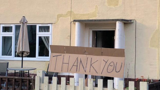 Thank you sign outside house