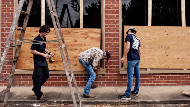 Businesses in Louisiana have been boarding up windows to help protect them from Hurricane Laura, 26 August 2020