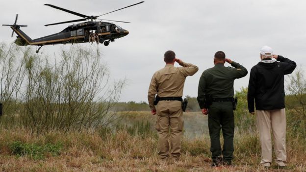 President Trump salutes a US Border Patrol helicopter in Mission, Texas, 10 January 2019