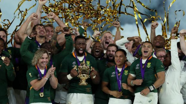 South Africa's Springboks celebrate after being handed the World Cup trophy