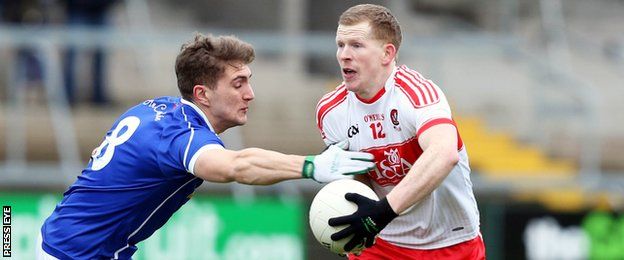 Cavan's Killian Clarke tackles Derry's Enda Lynn at the Athletic Grounds