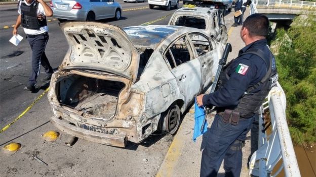Burned out car after clashes between a drug cartel and Mexican security forces on 18 October 2019