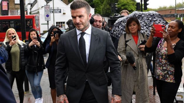 AFP/GETTY IMAGES The court heard Beckham was photographed driving in 'slowly moving' traffic while holding a phone