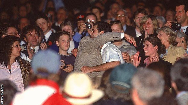 Pete Sampras hugs his dad after winning the Wimbledon title in 2000