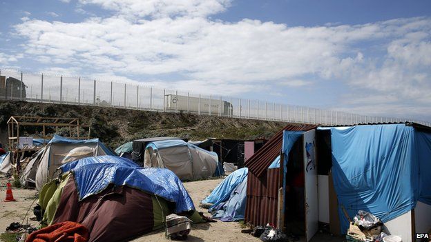 Migrants camped out near motorway in Calais