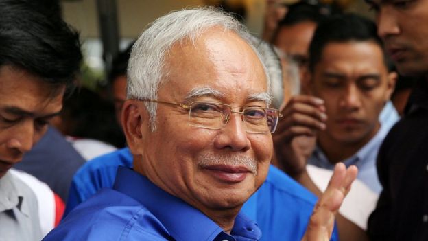 Malaysia's Najib Razak leaving a news conference on 11 May