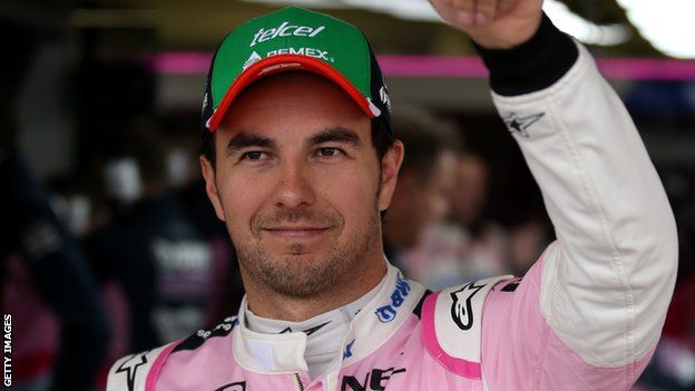 Sergio Perez waves to the crowd from the garage during final practice for the F1 Grand Prix of Mexico
