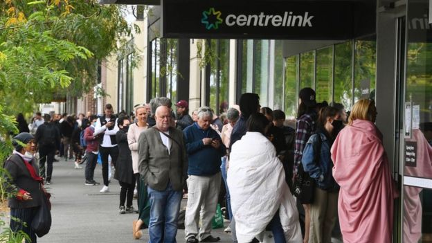 People line up for unemployment payments at a welfare office in Sydney