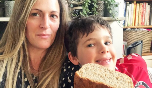 Zoe and her son with their homemade bread