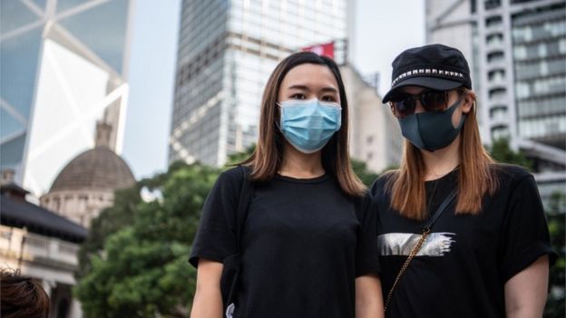 Two Hong Kong protesters wearing face masks, 5 October 2019