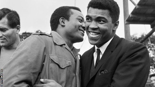 Muhammad Ali visits Jim Brown on the set of The Dirty Dozen in Hertfordshire in 1966