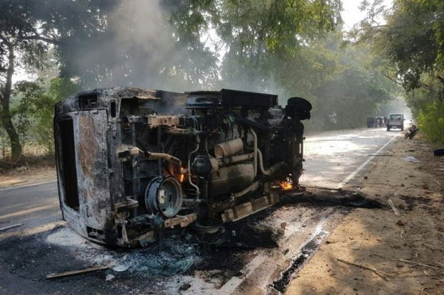 An upturned and smouldering vehicle is seen after mob violence at Chingravati village in Bulandshahr on 3 December 2018