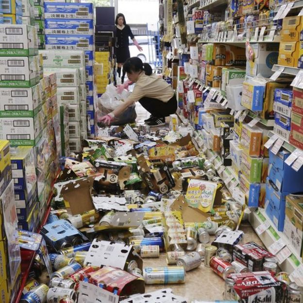 Supermarket with food fallen off the shelves