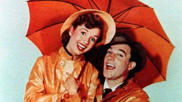 An undated file photo shows US actor Gene Kelly with actress Debbie Reynolds in the movie Singin' in the Rain