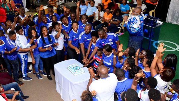 Cutting a Chelsea cake