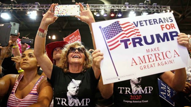 Supporters of U.S. President Donald Trump cheer him at a campaign rally in Phoenix, Arizona, U.S., August 22, 2017.