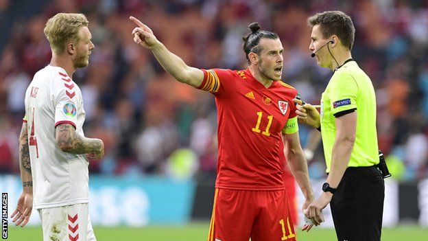 Gareth Bale protests to referee Daniel Siebert following Denmark's second goal, which Wales felt should have been ruled out for a foul on Kieffer Moore