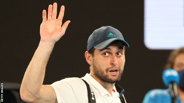 Aslan Karatsev waves goodbye to the Melbourne crowd after losing to Novak Djokovic