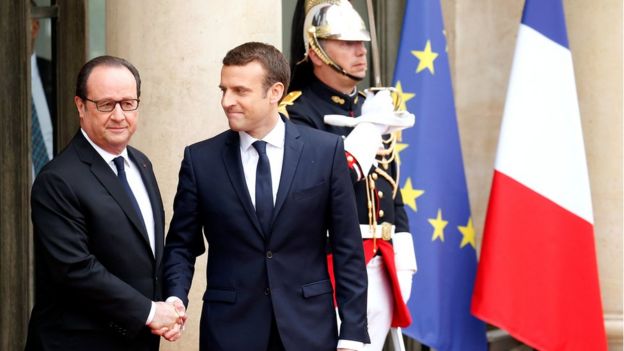 Outgoing French President Francois Hollande greets President-elect Emmanuel Macron who arrives to attend the handover ceremony at the Elysee Palace in Paris, France, 14 May 2017.