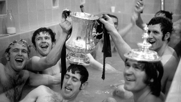 Chelsea team with the FA Cup in the bath after the 1970 final replay